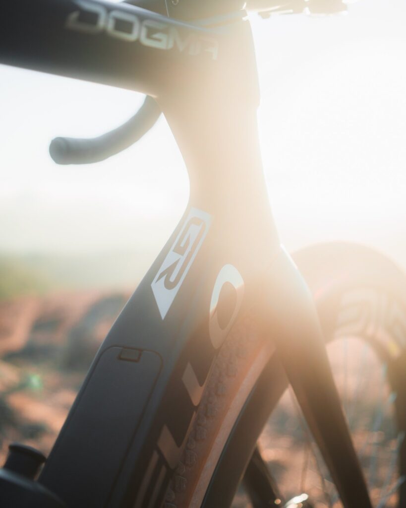 Backlit fork and head tube of the Dogma GR with sun flare