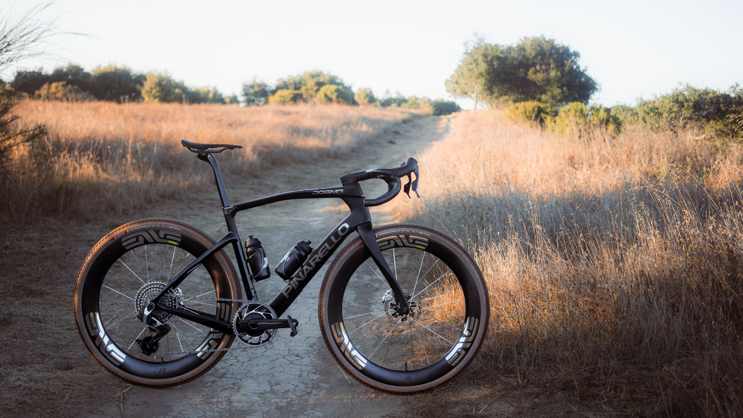 The Pinarello Dogma GR on a dirt trail at golden hour